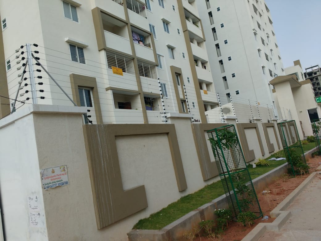 Apartment compound wall protected with electric solar fencing