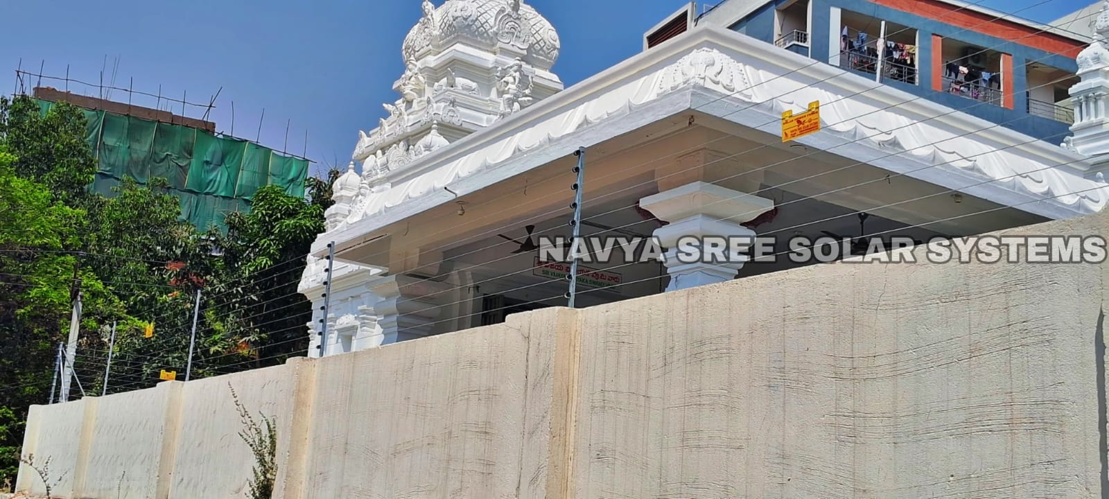 Temple boundary wall with solar power fencing