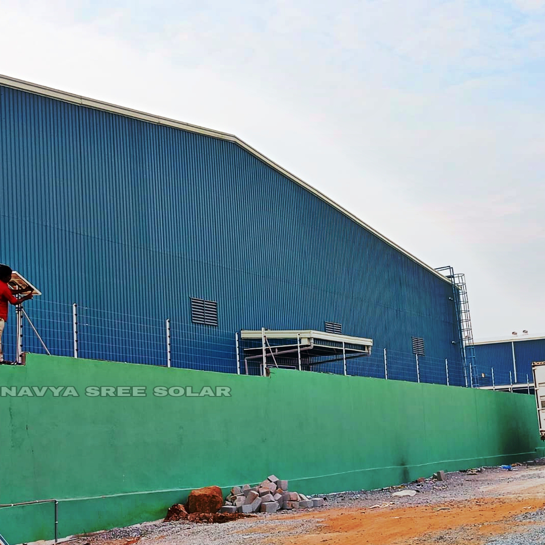 Factory wall secured with solar power fencing
