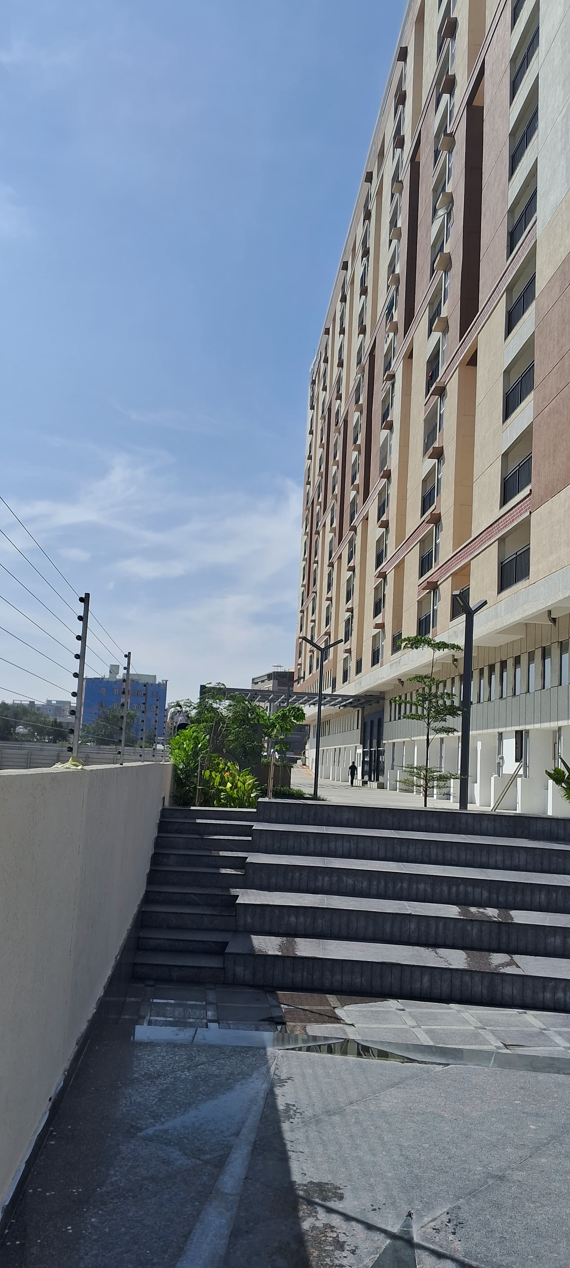 High-rise apartment boundary wall with solar fencing