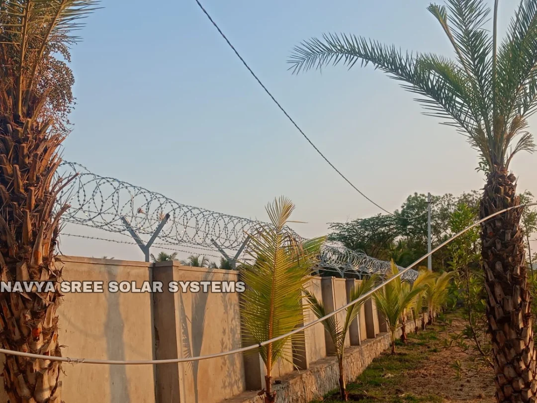 Razor blade fence line installed along landscaped property