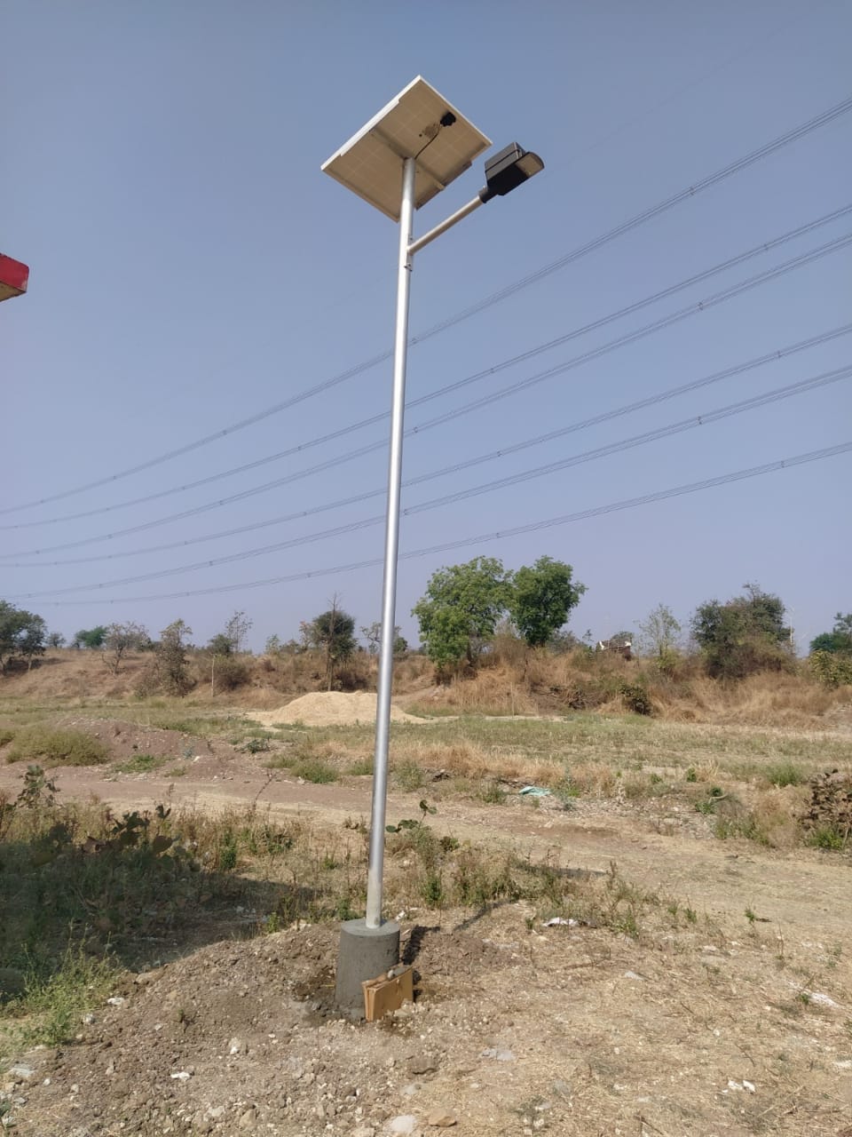 Solar panel mounted on pole with light fixture
